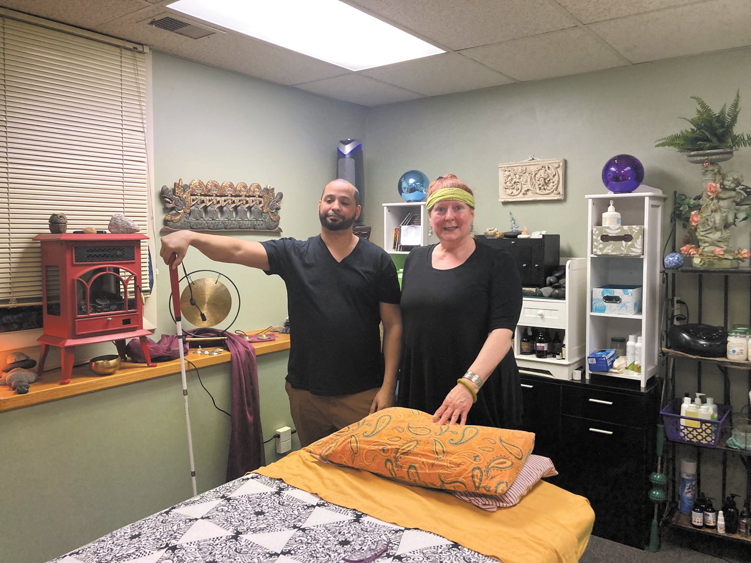 READY TO SERVE: JR is a licensed massage therapist and, while he is visually-impaired, he is looking forward to giving back to the community. With him is Cheryl D’Itri, owner of It’s Your Body’s Symphony.